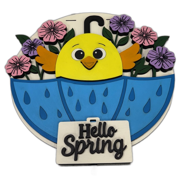 Round wood sign with a baby chick peeking out of an umbrella surrounded by flowers