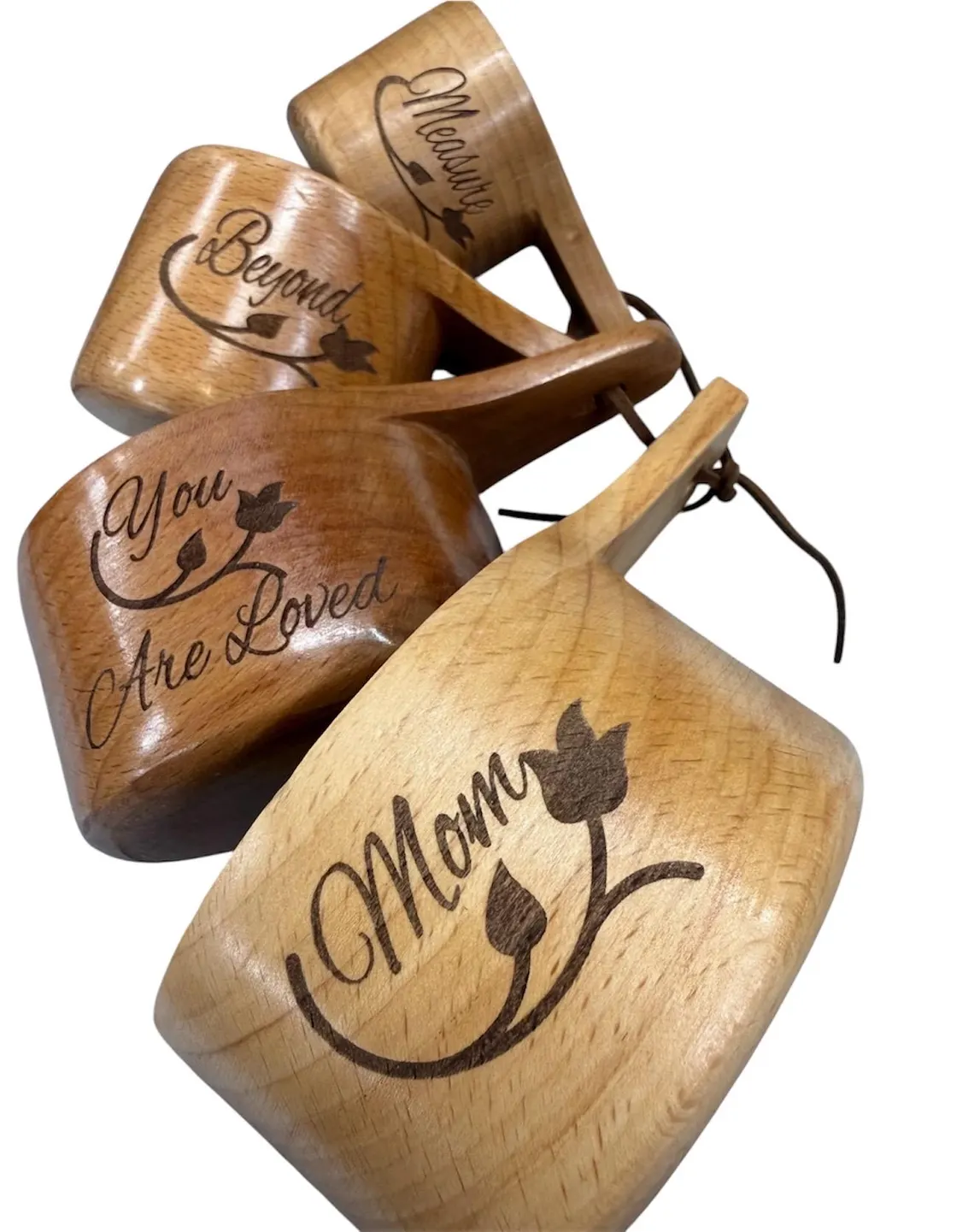 Wooden measuring cups laser engraved with 'Mom', 'You Are Loved', 'Beyond', and 'Measure' in script lettering