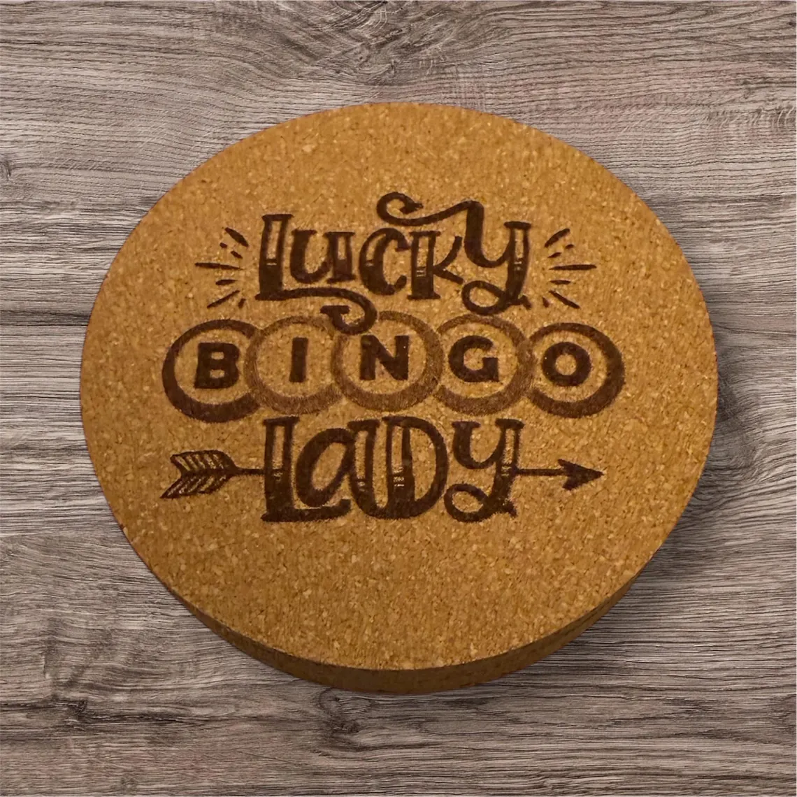 Round cork coaster laser engraved with 'Lucky Bingo Lady' and an arrow design