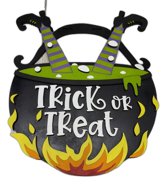 Bubbling cauldron wood sign with witch boots, flames, and 'Trick or Treat' lettering